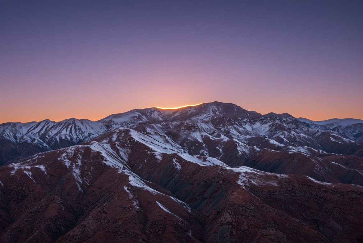 Concept study of a final line of sunlight crossing a mountain ridge.